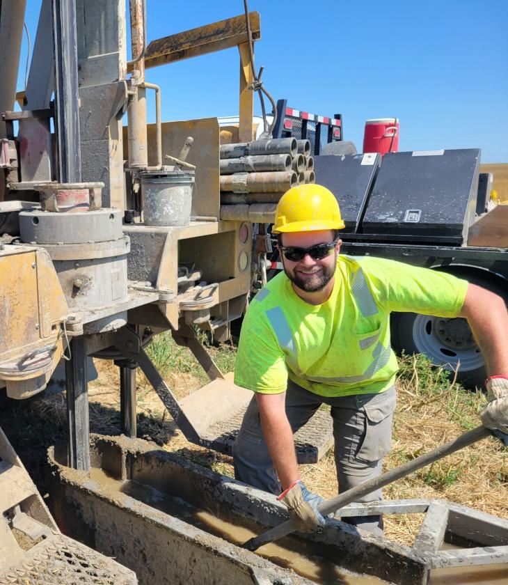 male geology student working with mining machinery