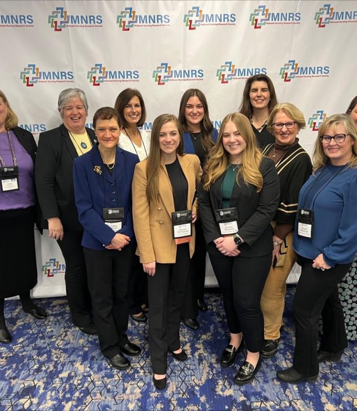 Nursing conference group shot of faculty and grad students 