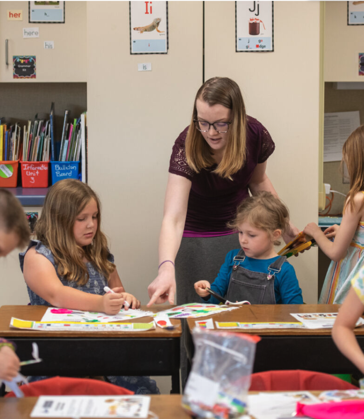 A picture of an individual teaching school-age children