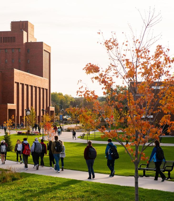 Students make their way through Garfield avenue on lower campus.