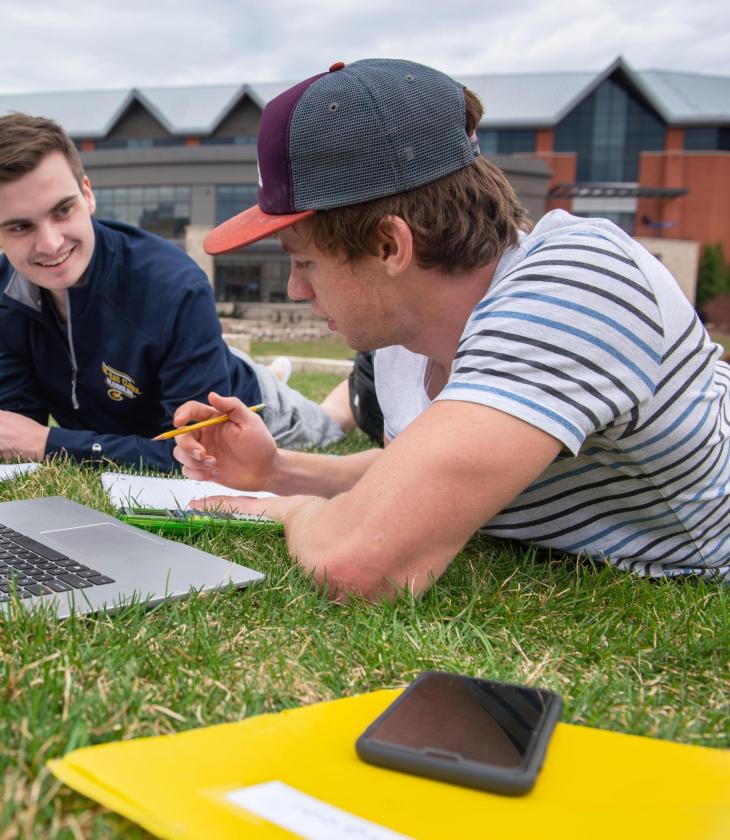 Finance students studying outside