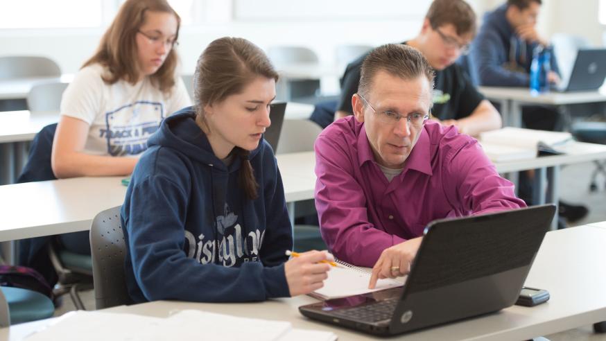 Math instructor working with a student