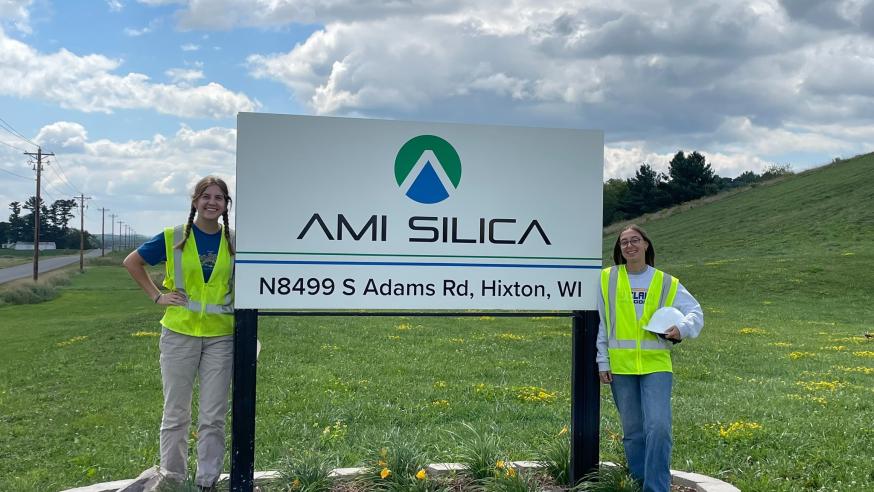 geology student interns at area industry signage