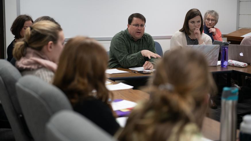 Mike Axelrod in class with school psychology students 