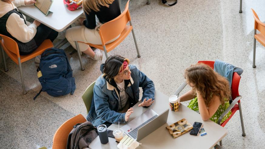 students at a table in Davies