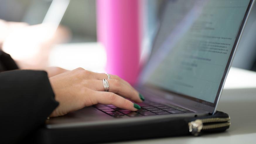 Laptop in use at a table 