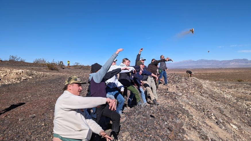 field students for geol throwing rocks