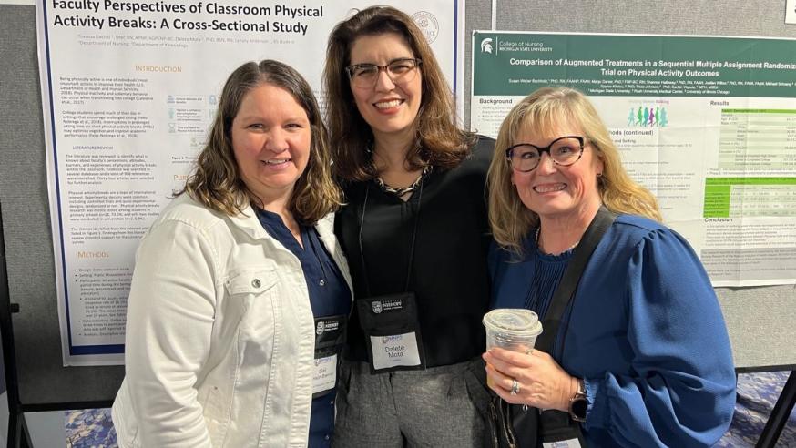 nursing faculty and students at a research event 