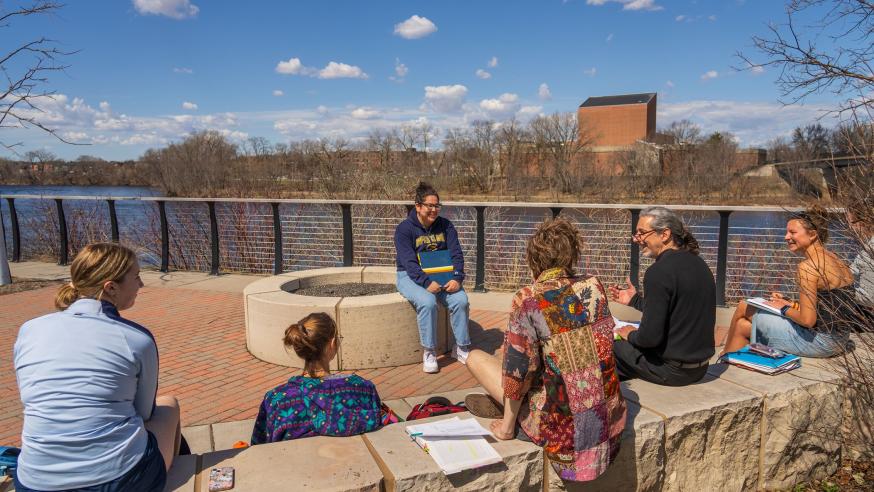 Manny Fernandez and class outside by the river