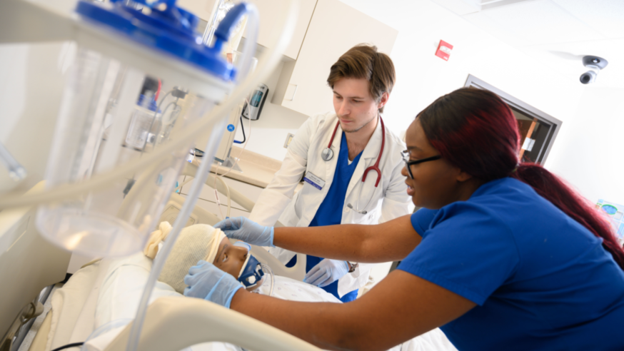 Nursing students participate in a care simulation