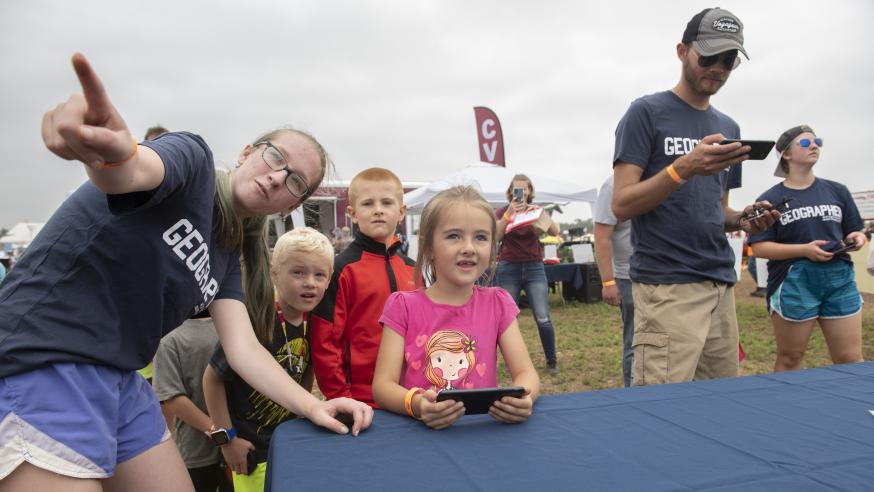 Students and area kids at drone table fair event