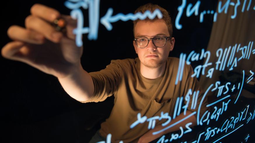 Mathematics student Tyler Gonzales solving equations