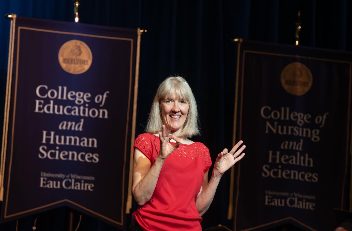 woman doing ASL translation at commencement 