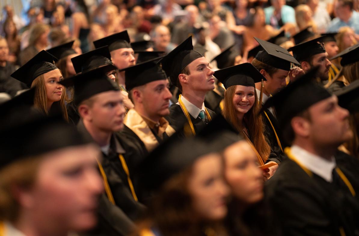 grads in the crowd at commencement 