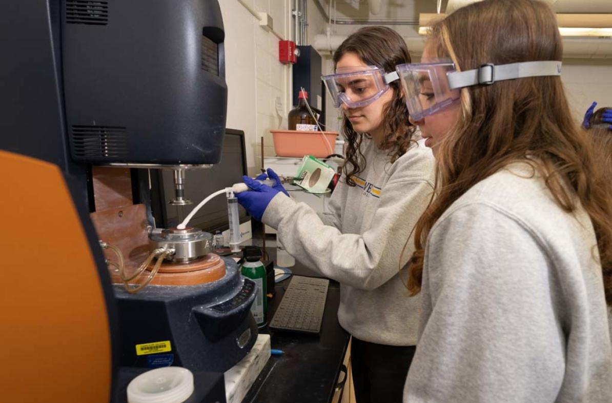 Foam lab research students using instrumentation