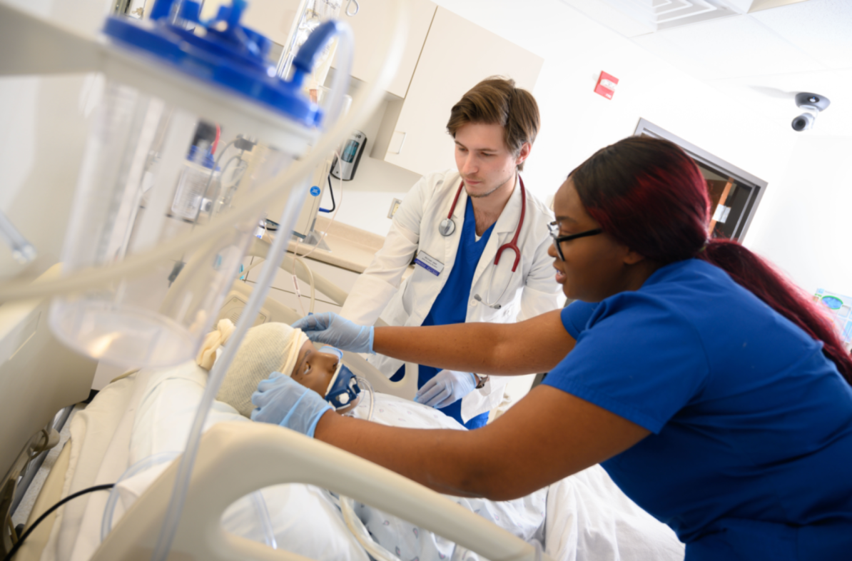 Nursing students participate in a care simulation