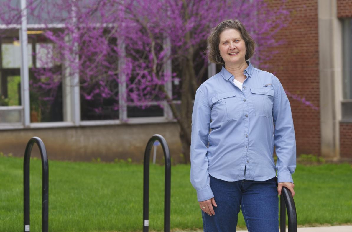 Daria Hutchinson standing outside library breezeway 