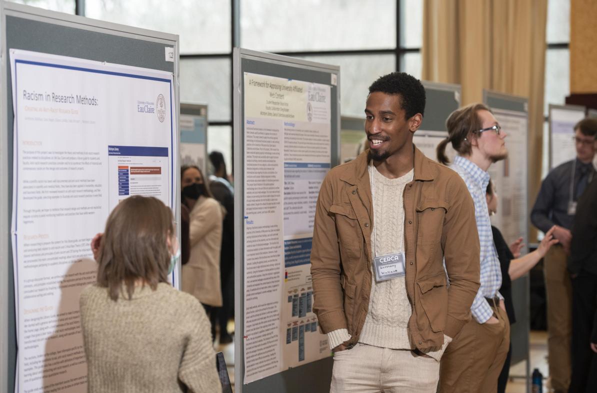 Male student presenting research at CERCA poster event