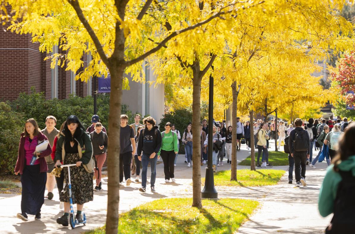 Students walking on campus in fall