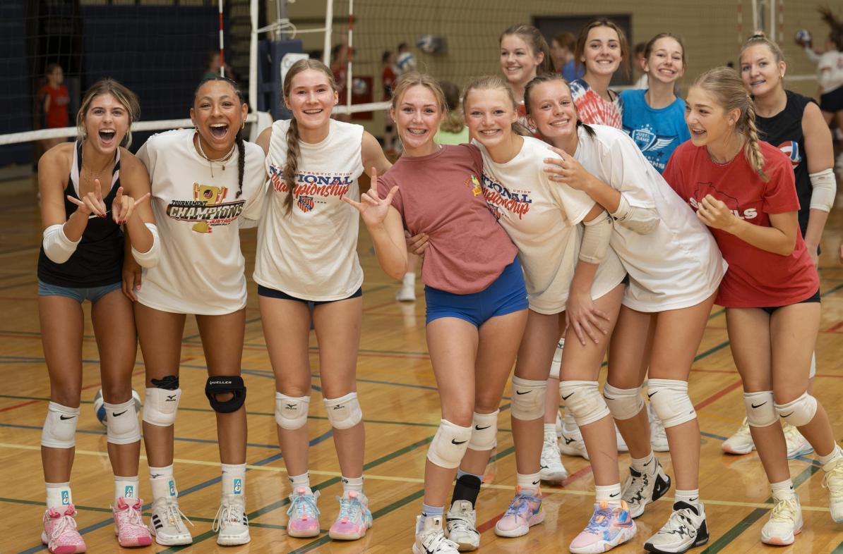 volleyball youth players posing for group shot