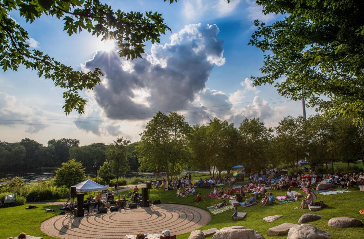 Music lovers in Eau Claire enjoying the Sounds Like Summer Concert Series in Phoenix Park.